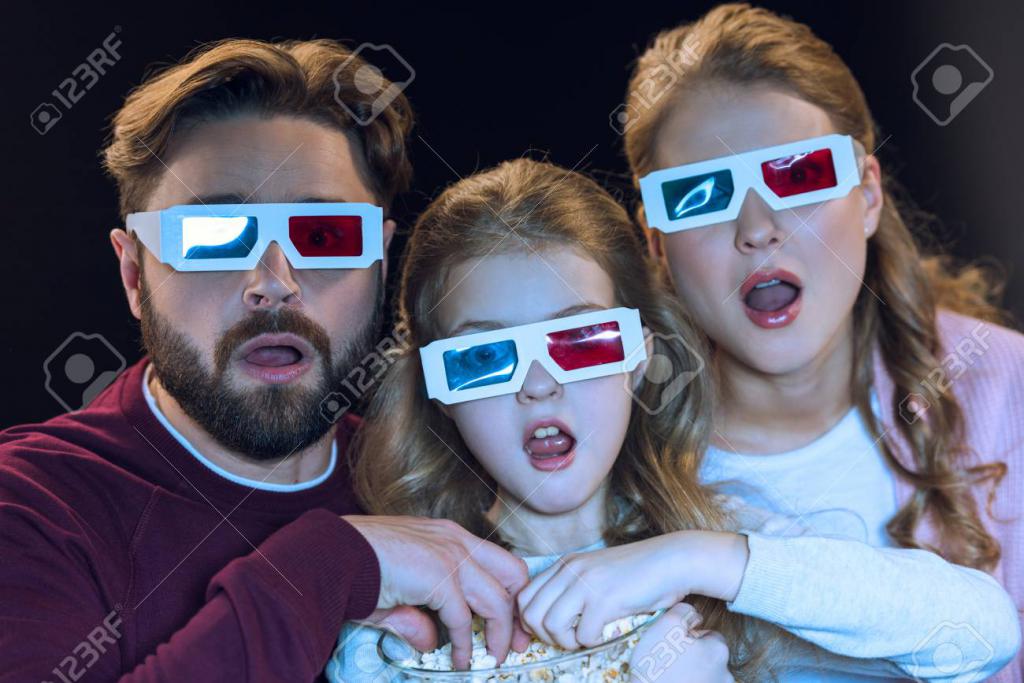 76606508-family-in-3d-glasses-watching-movie-and-eating-popcorn-from-bowl.jpg